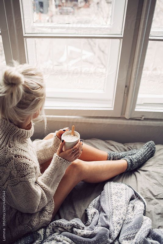 Blonde Woman Drinking Morning Coffee in Bed by lumina | Stocksy United