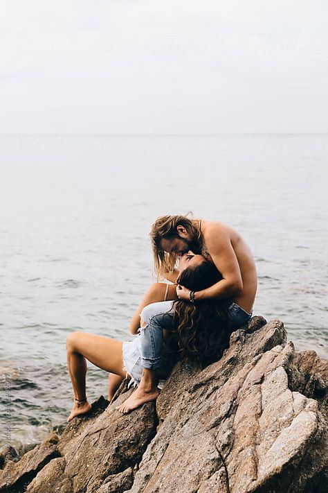 Stock photo of Woman and man kissing on the beach by pavloffav