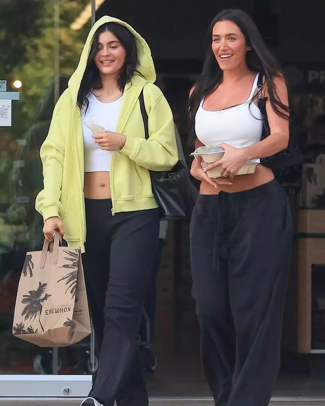 Kylie Jenner wearing Khy Fleece Straight Leg Pant Khy Cropped Raw Hem Rib Tank Salomon Xt Slate Sneakers and Khy Fleece Oversized Zip Hoodie 2