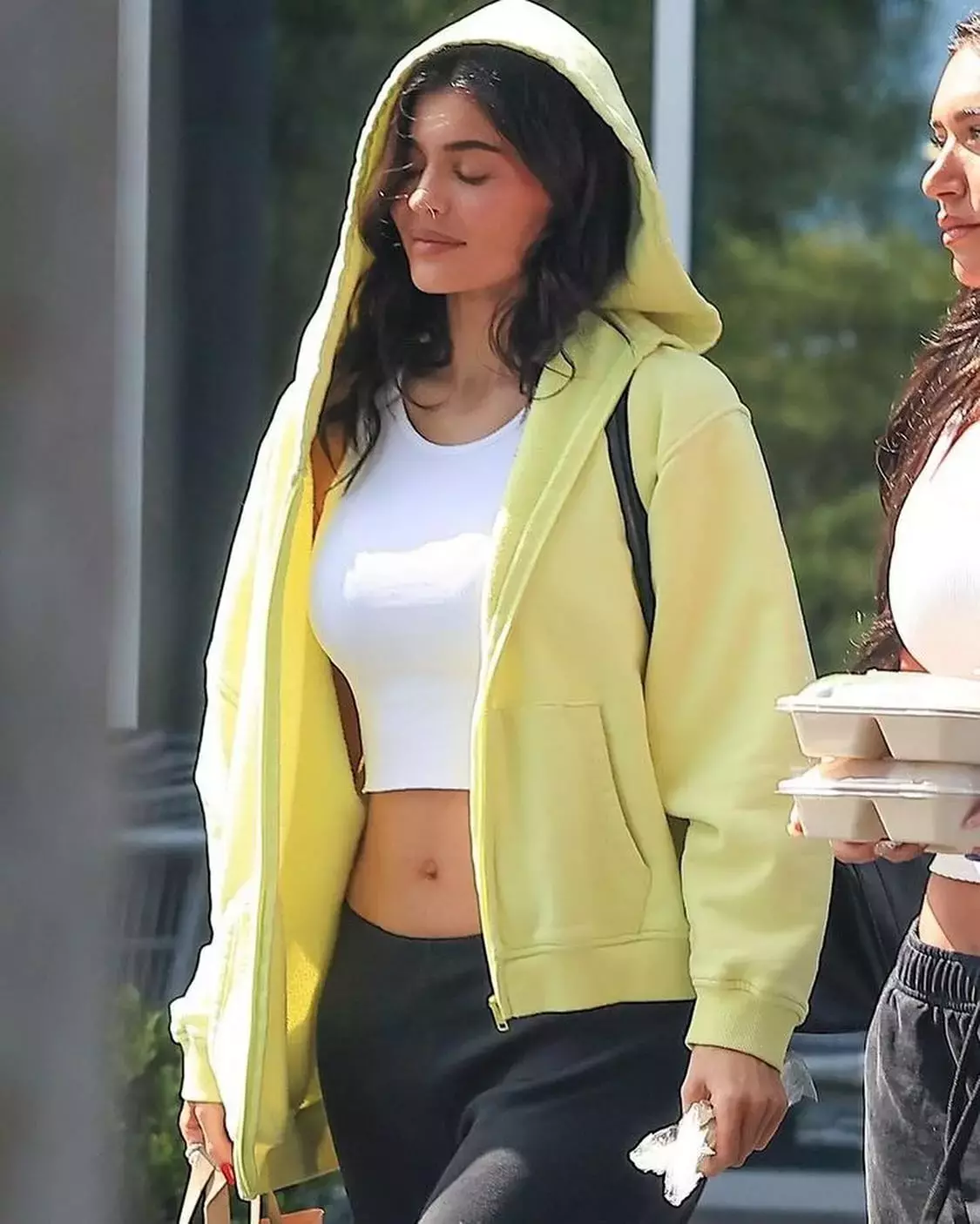 Kylie Jenner wearing Khy Fleece Straight Leg Pant Khy Cropped Raw Hem Rib Tank Salomon Xt Slate Sneakers and Khy Fleece Oversized Zip Hoodie 3