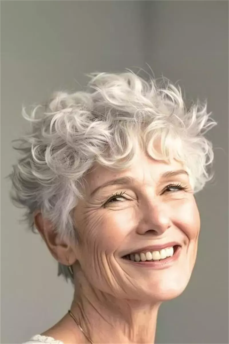 woman over 60 short snowy curls 33