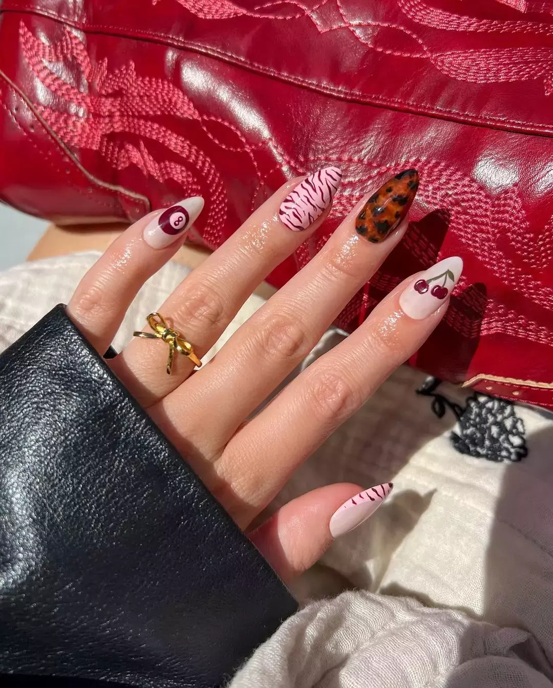 Mismatched Cherry And Leopard Nails