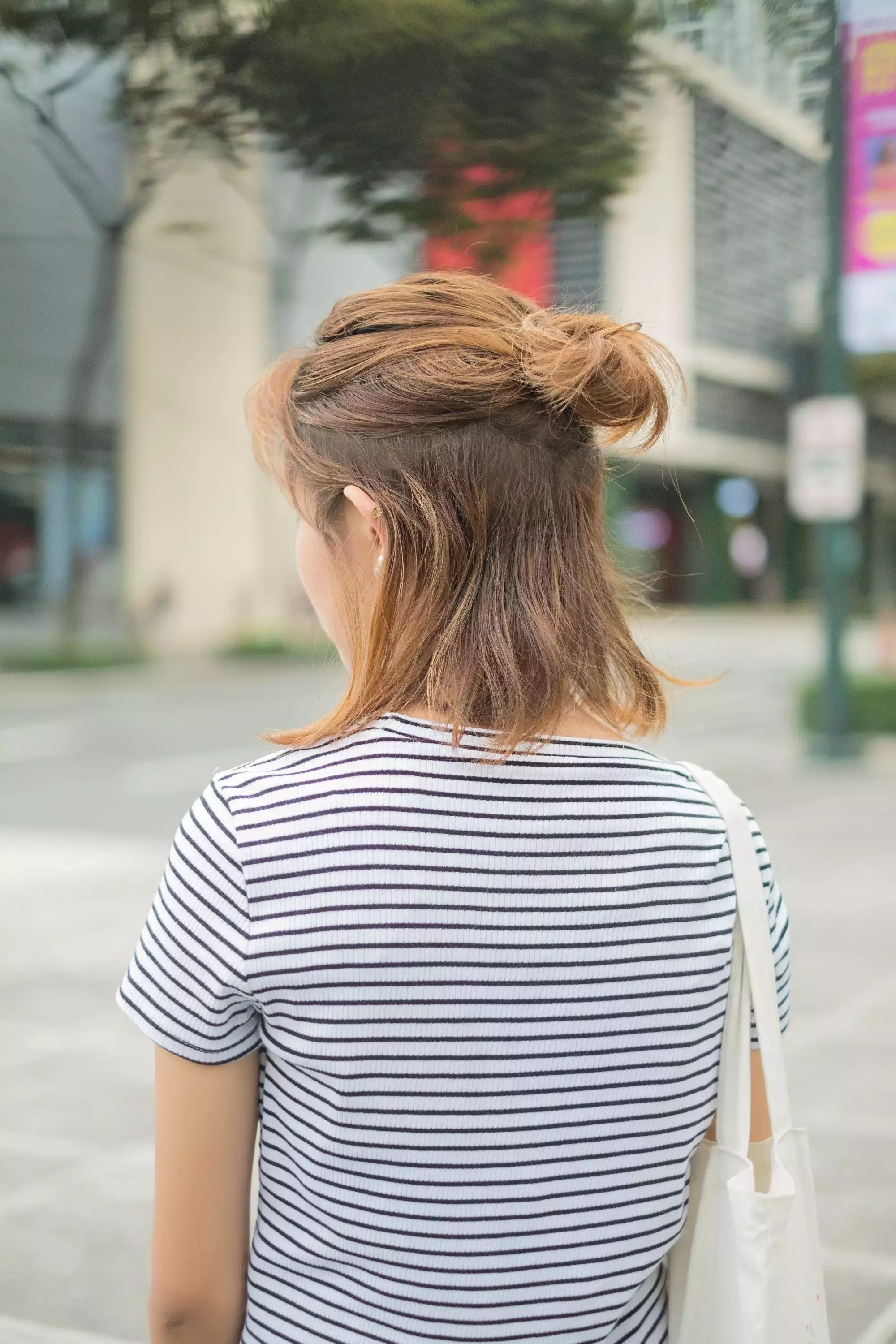 Golden Brown Hair In A Messy Bun